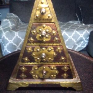 This box was made in Indonesia,It has 4 drawers & makes a great jewelry box